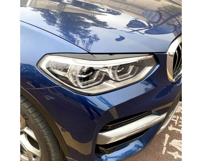 BMW Valoluomet X3 G01 G02 2018– – Kiiltävän musta. - BMW Headlight Covers X3 G01 G02 2018– – Glossy Black Evil Eye – Gloss black. - BMW Scheinwerferblenden X3 G01 G02 ab 2018 – Glänzend Schwarz (Böser Blick) – Glänzend schwarz.