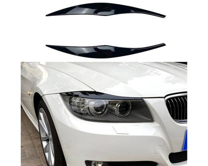 BMW Valoluomet E90 E91 2005–2012 – Kiiltävän musta. - BMW Headlight Covers E90 E91 2005–2012 – Gloss black. - BMW Scheinwerferblenden E90 E91 2005–2012 – Schwarz Glanz (Böser Blick) – Glänzend schwarz.